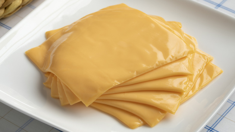 Slices of rubbery American cheese