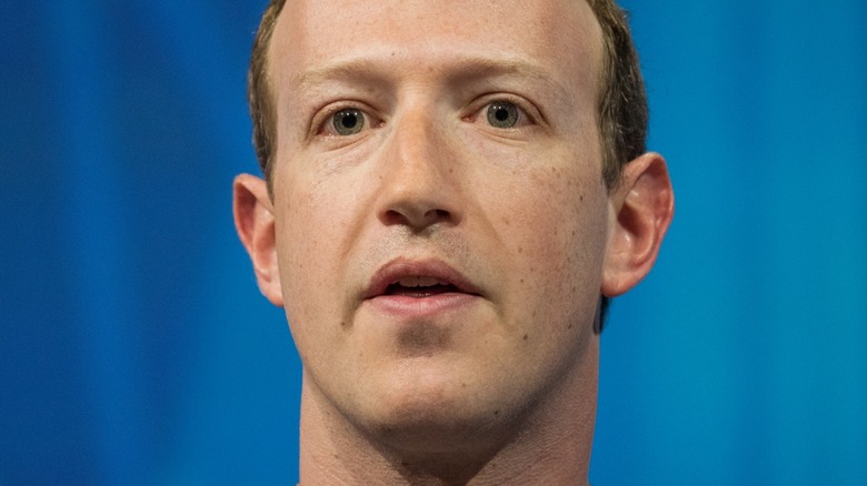 Mark Zuckerberg against blue background
