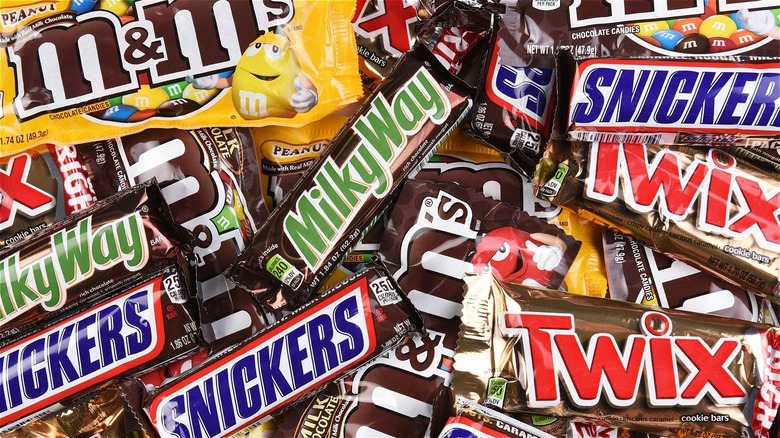 mix of candy in package: M&Ms, Milky Way, Snickers, Twix