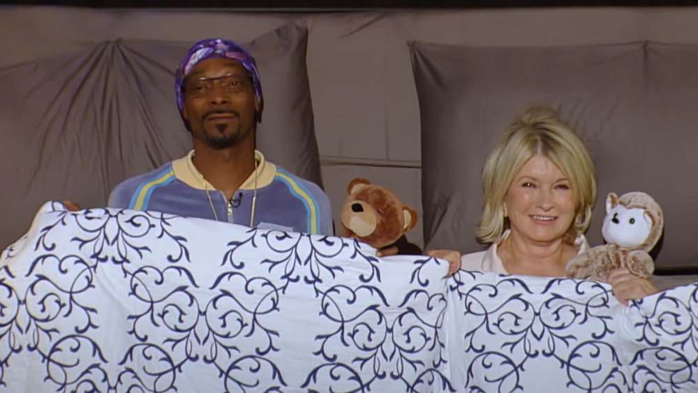 Martha and Snoop in a bed