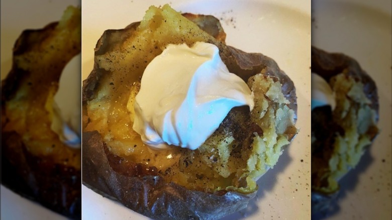 Smashed baked potato with sour cream