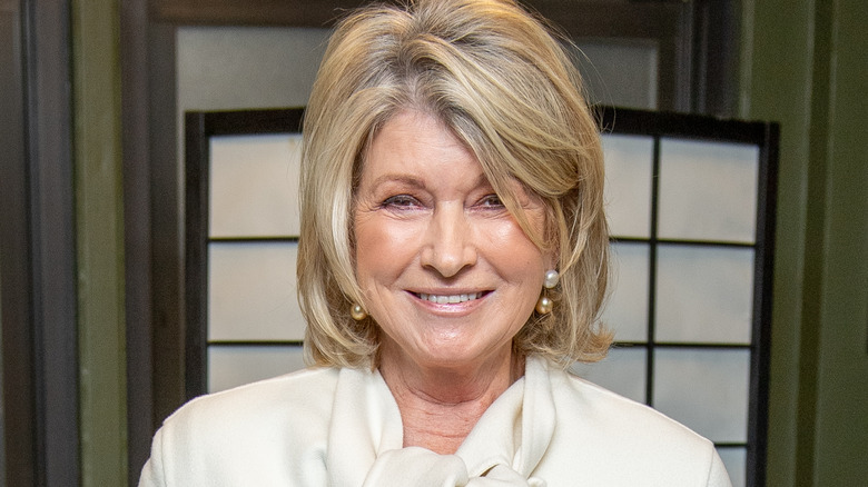 Martha Stewart smiling in white blouse