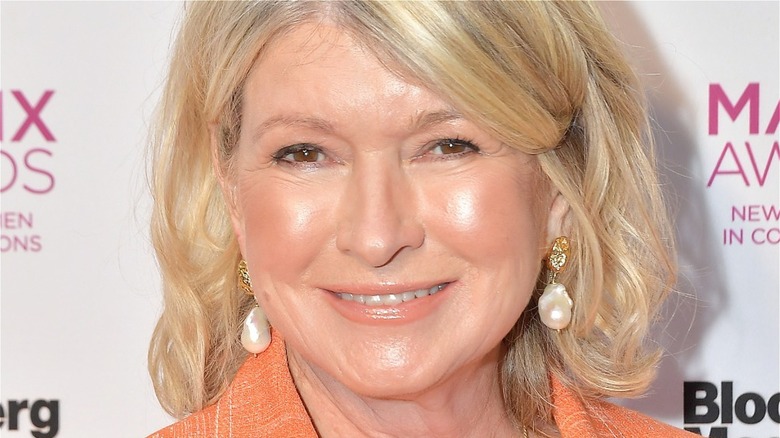 Martha Stewart wearing earrings and smiling