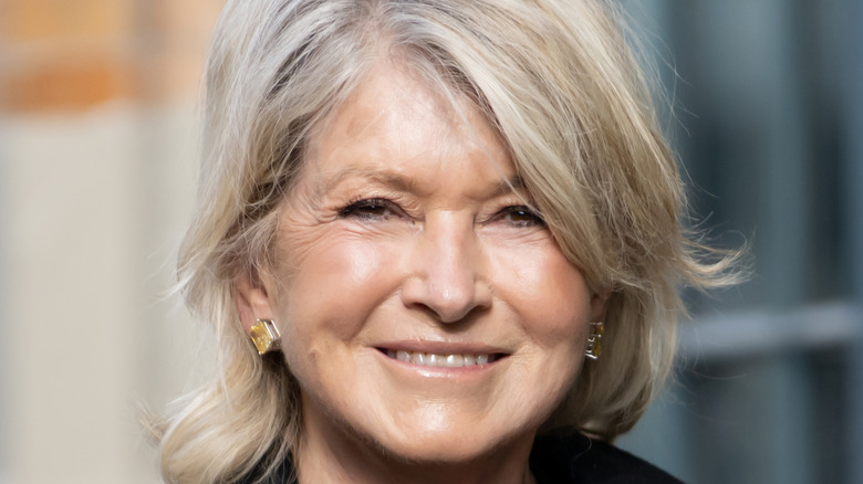 Martha Stewart smiling and wearing a earrings