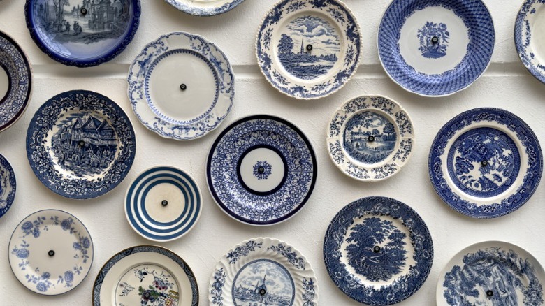 Vintage china plates hung on a wall