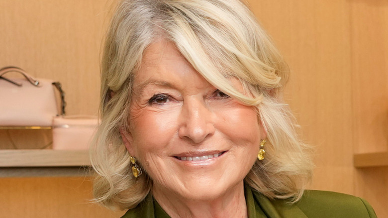 Martha Stewart smiling in yellow diamond earrings