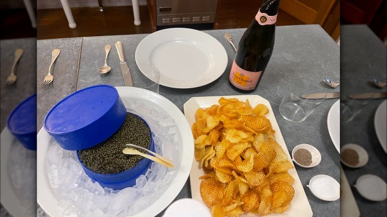 Caviar, homemade waffle chips, and champagne