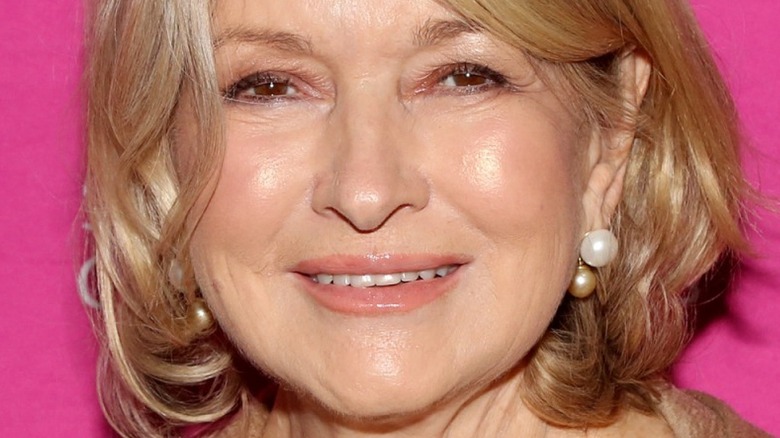 Martha Stewart with wide smile and pearl earrings