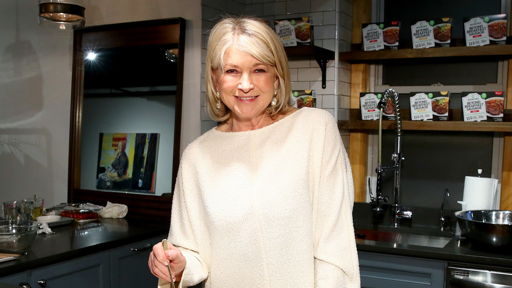 Martha Stewart posing in a kitchen