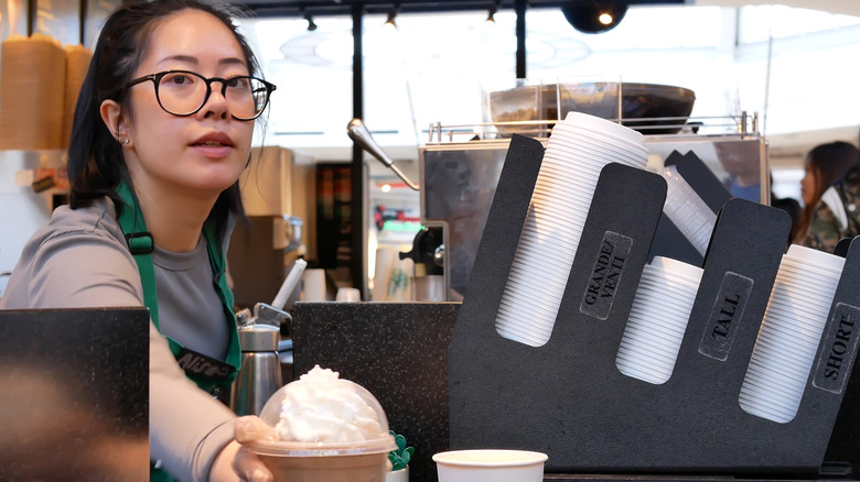 Starbucks barista with frappuccino