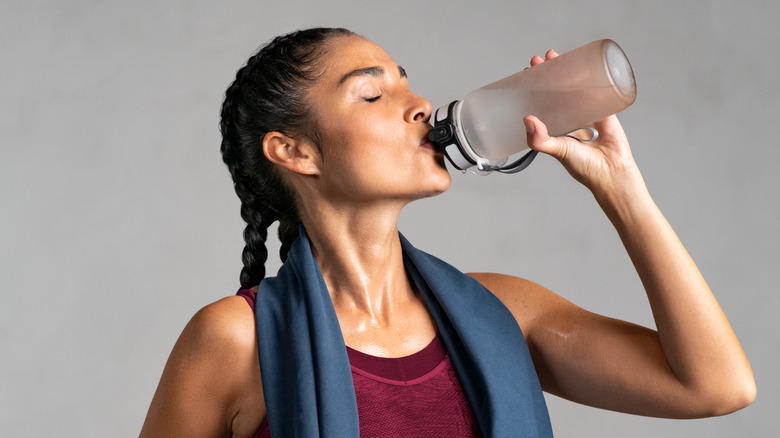 Woman drinks a protein drink