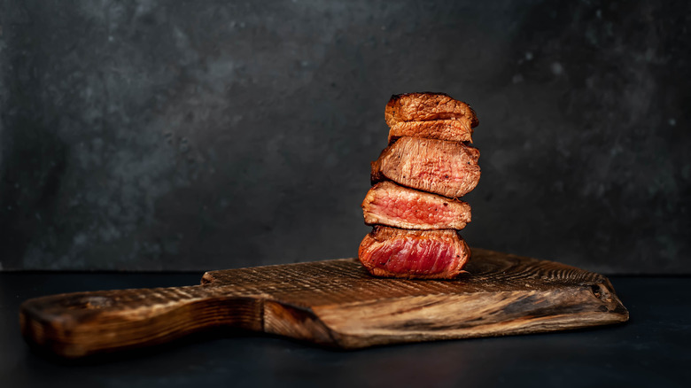 Steaks at different stages of "doneness."