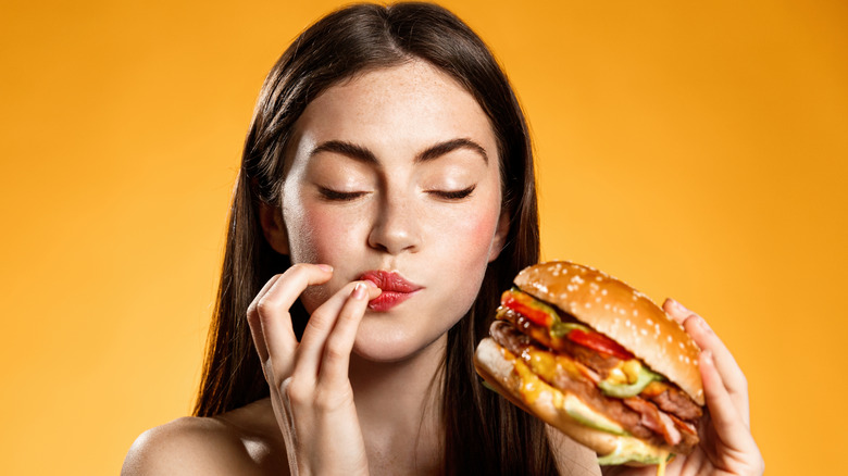 person eating burger