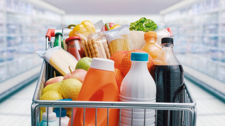 Supermarket cart filled with groceries