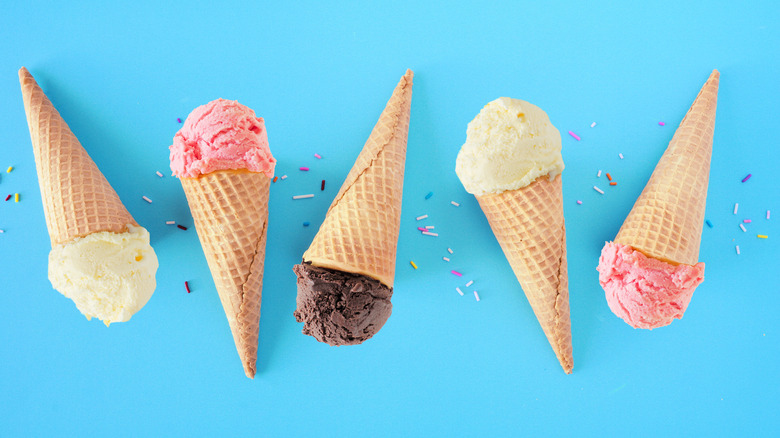 sugar cones of vanilla chocolate strawberry ice cream 