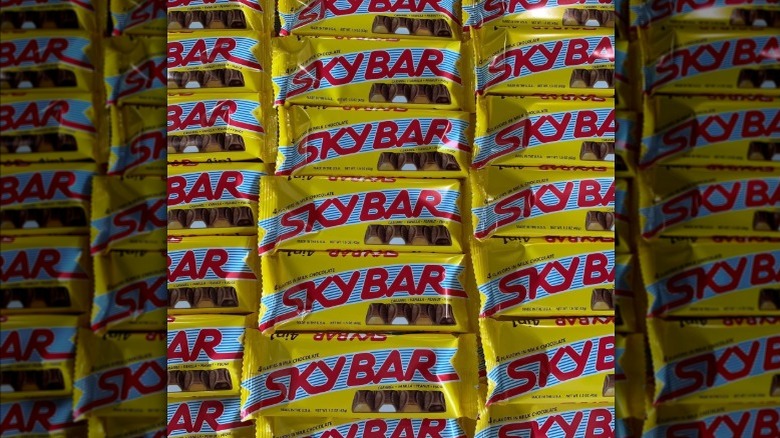 Multiple Sky Bars in yellow and red packaging closeup