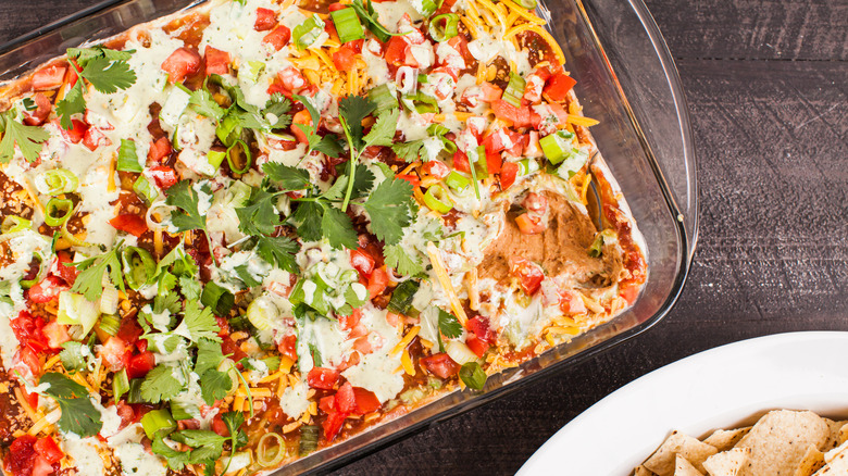 Seven layer dip in a casserole dish