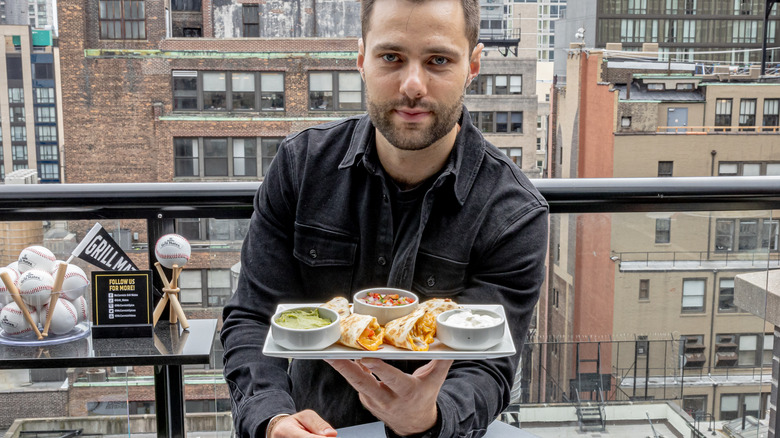 Max Greb with grilled food 