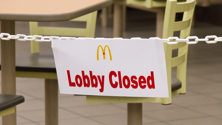 A "lobby closed" sign in a McDonald's