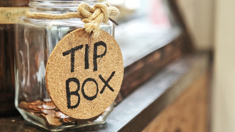 tip jar with coins