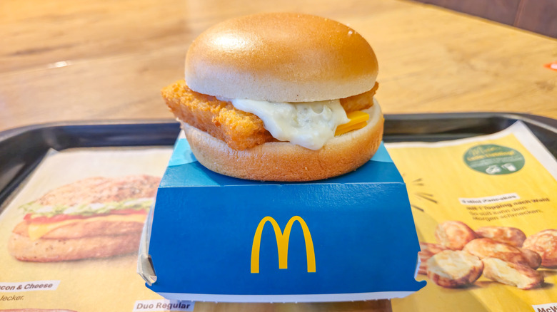 McDonald's Filet-O-Fish sandwich on top of blue box.