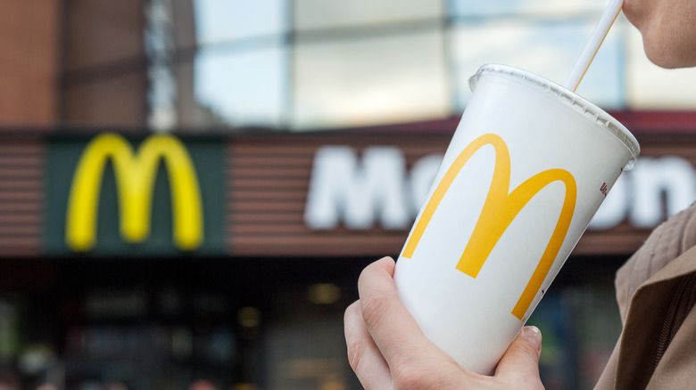 Person sipping on a McDonald's drink