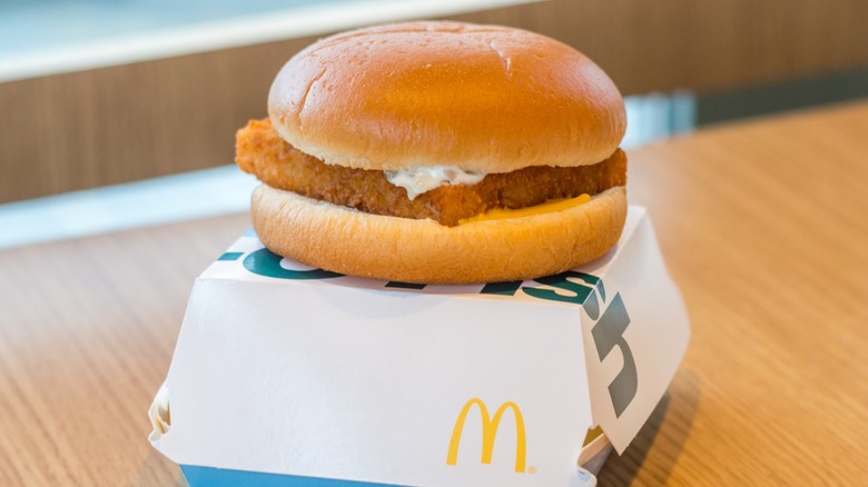 McDonald's Filet-O-Fish sandwich atop a cardboard box