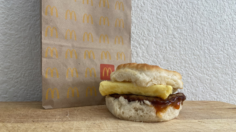 the Hot Honey biscuit on a cutting board with McDonald's bag