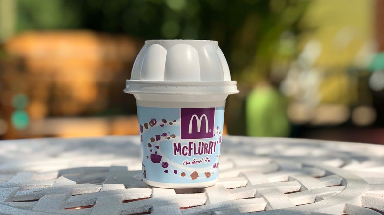 McDonalds cup with "McFlurry" printed on side.
