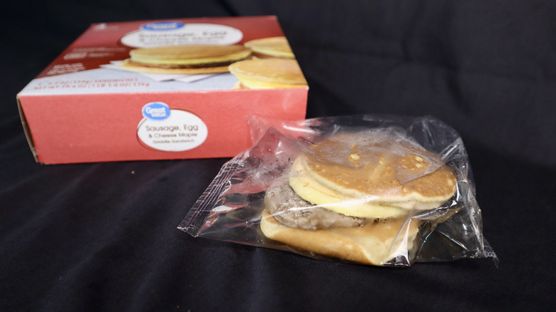 frozen breakfast sandwich in plastic in front of box