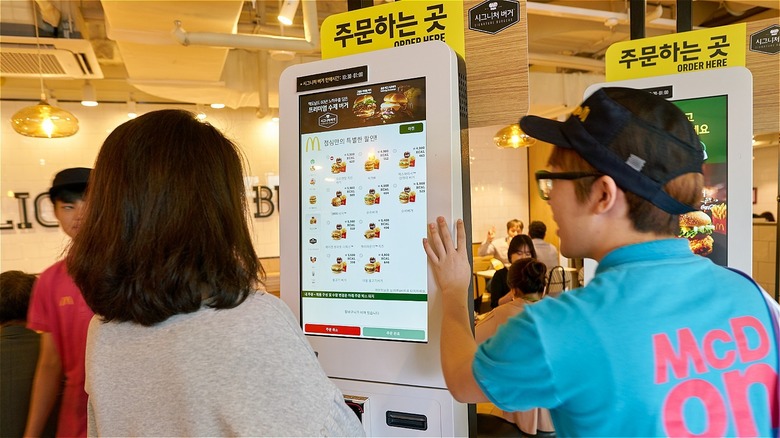 Customers order on a screen at McDonald's