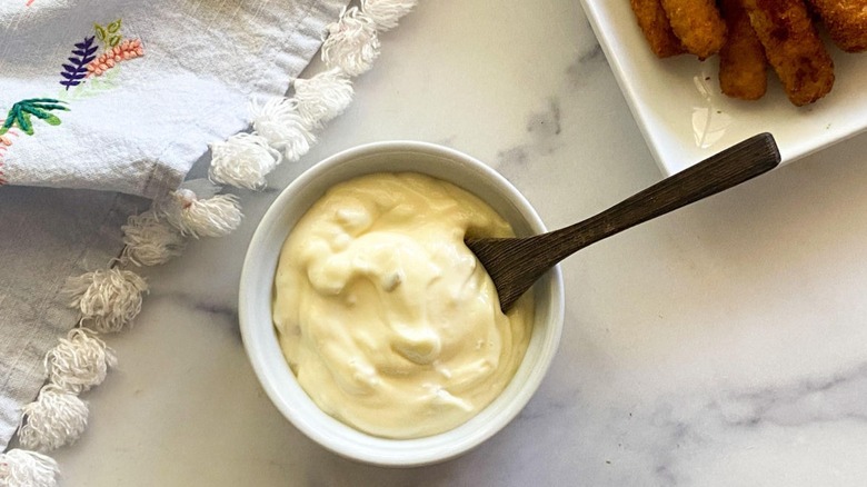 Tartar sauce in bowl with spoon