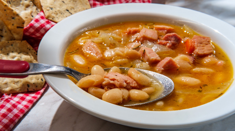 Close up of navy bean soup and ham hocks