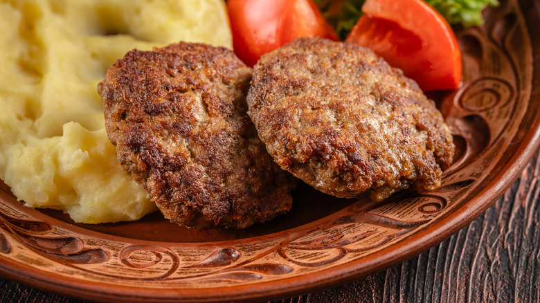 Close-up of meat patties with mashed potatoes