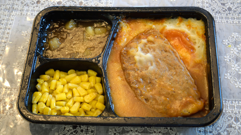 TV dinner of meatloaf with gravy, corn and other vegetable