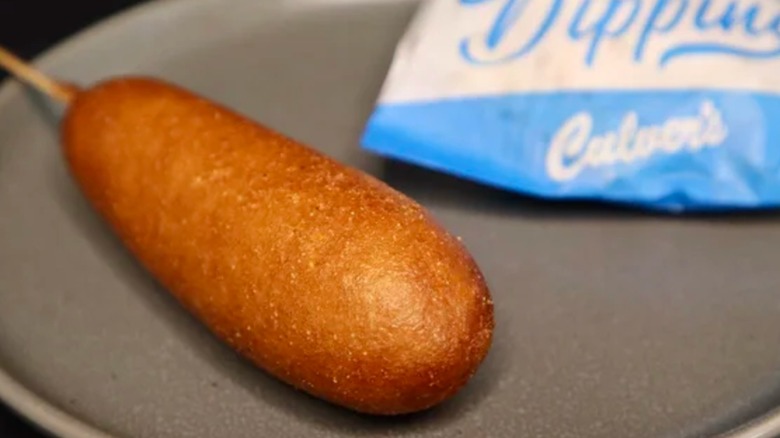 A closeup of Culver's battered fried pork corn dog