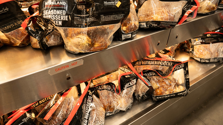 Rotisserie chickens stocked on heated shelves