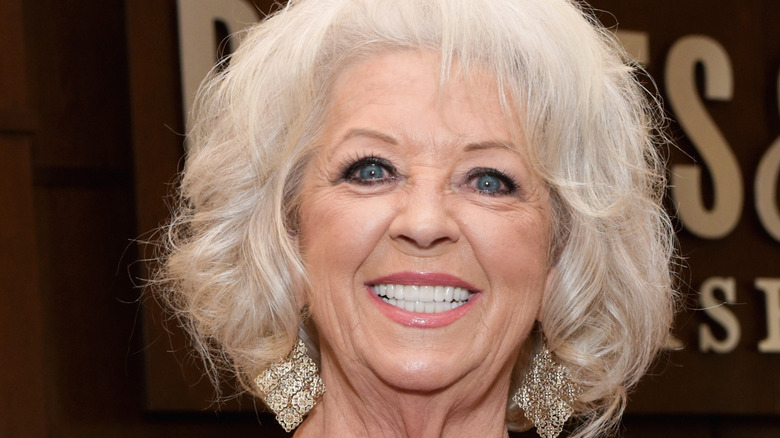 Paula Deen smiling wearing earrings