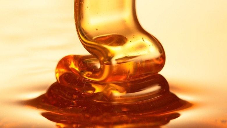 Honey pouring onto more honey