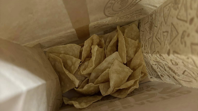 A bag of Chipotle chips barely full with a lot of empty space