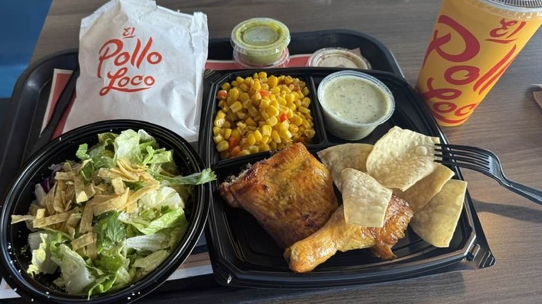 Overhead view of a chicken meal from El Pollo Loco with chips and salsa on the side