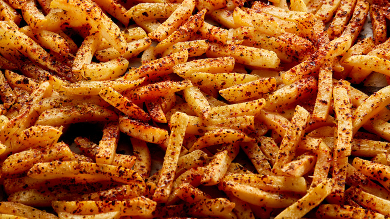 Coseup of a cluster of heavily seasoned fries