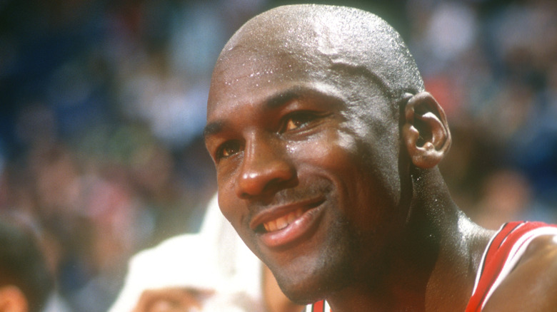 Michael Jordan smiling at NBA game