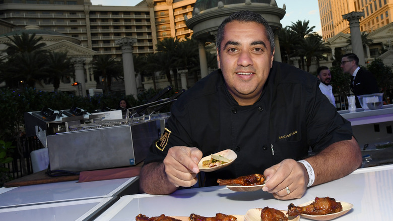 Michael Mina eating chicken in Vegas