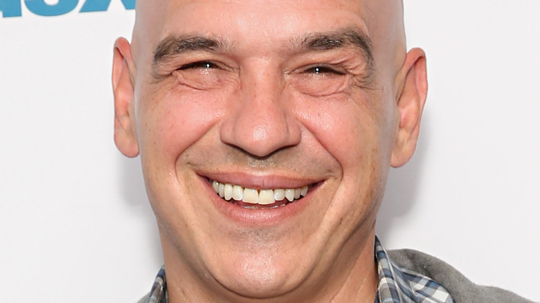 Michael Symon smiling wide