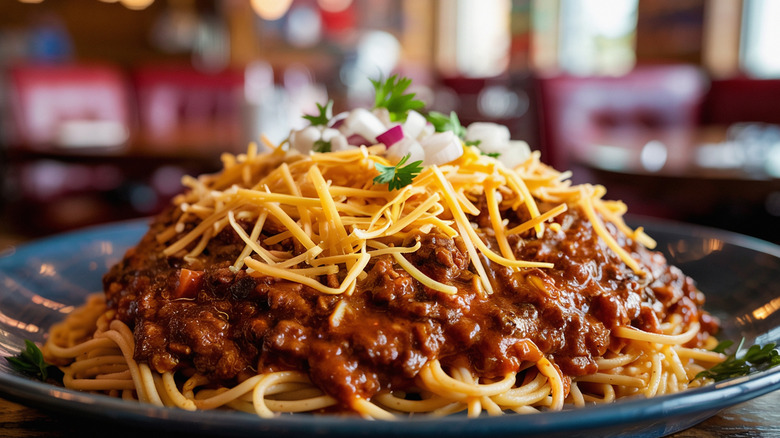 bowl of Cincinnati chili with shredded cheese on top