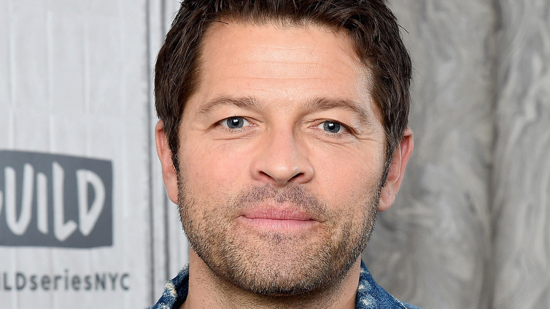 Misha Collins on gray background