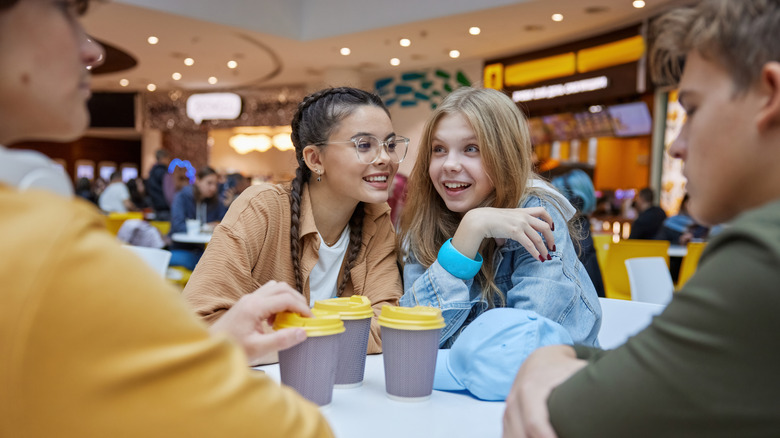 Group of teens at mall food court