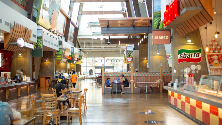 Mall food court with several eateries visible
