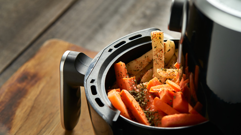 Air fryer packed with vegetables